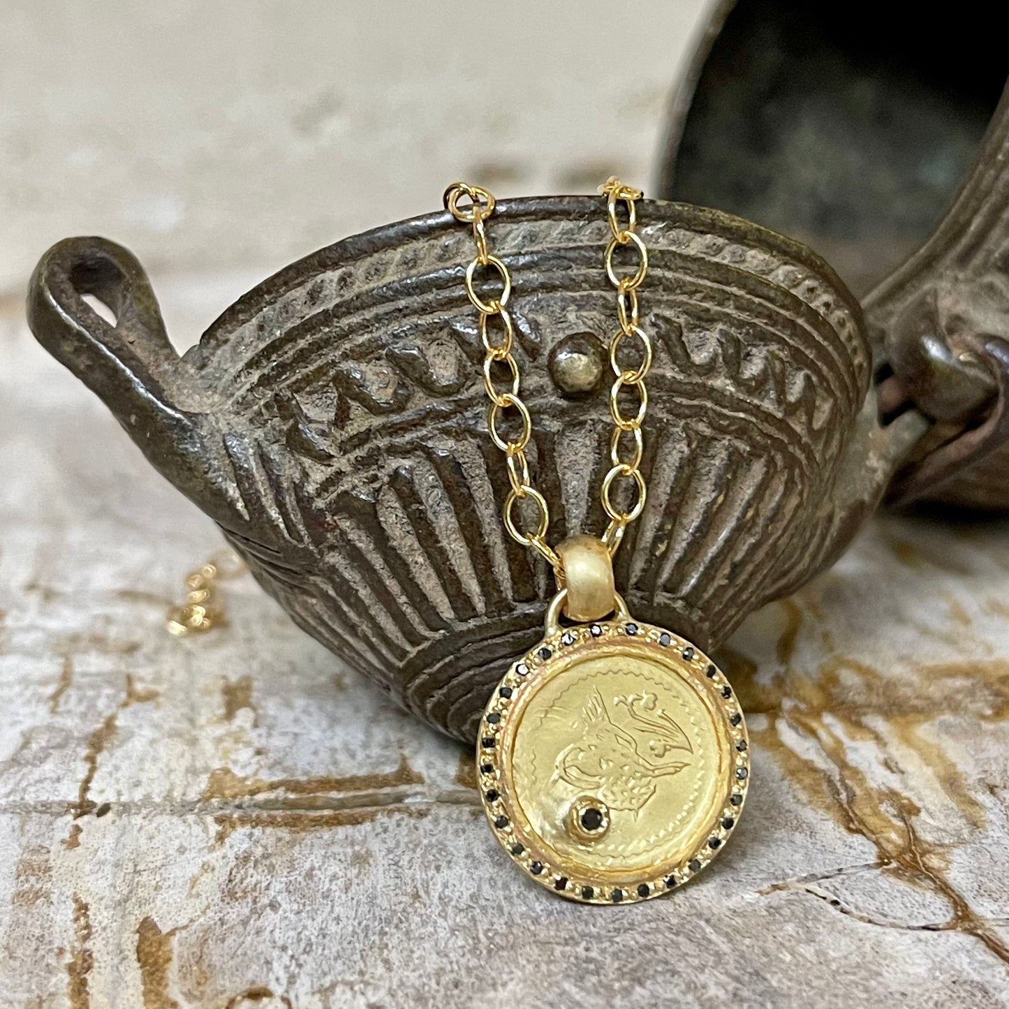 Antique gold coin and black diamond pendant necklace