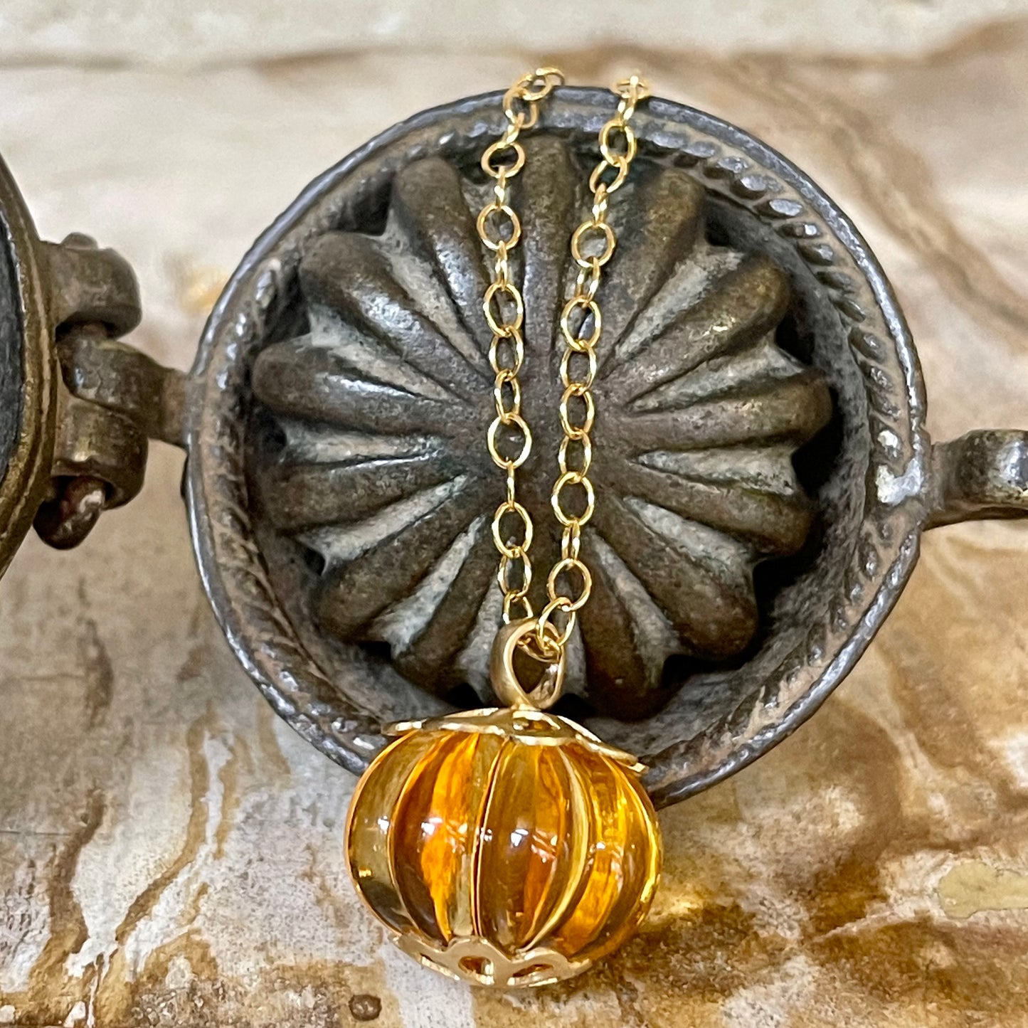 Carved citrine and gold pendant necklace
