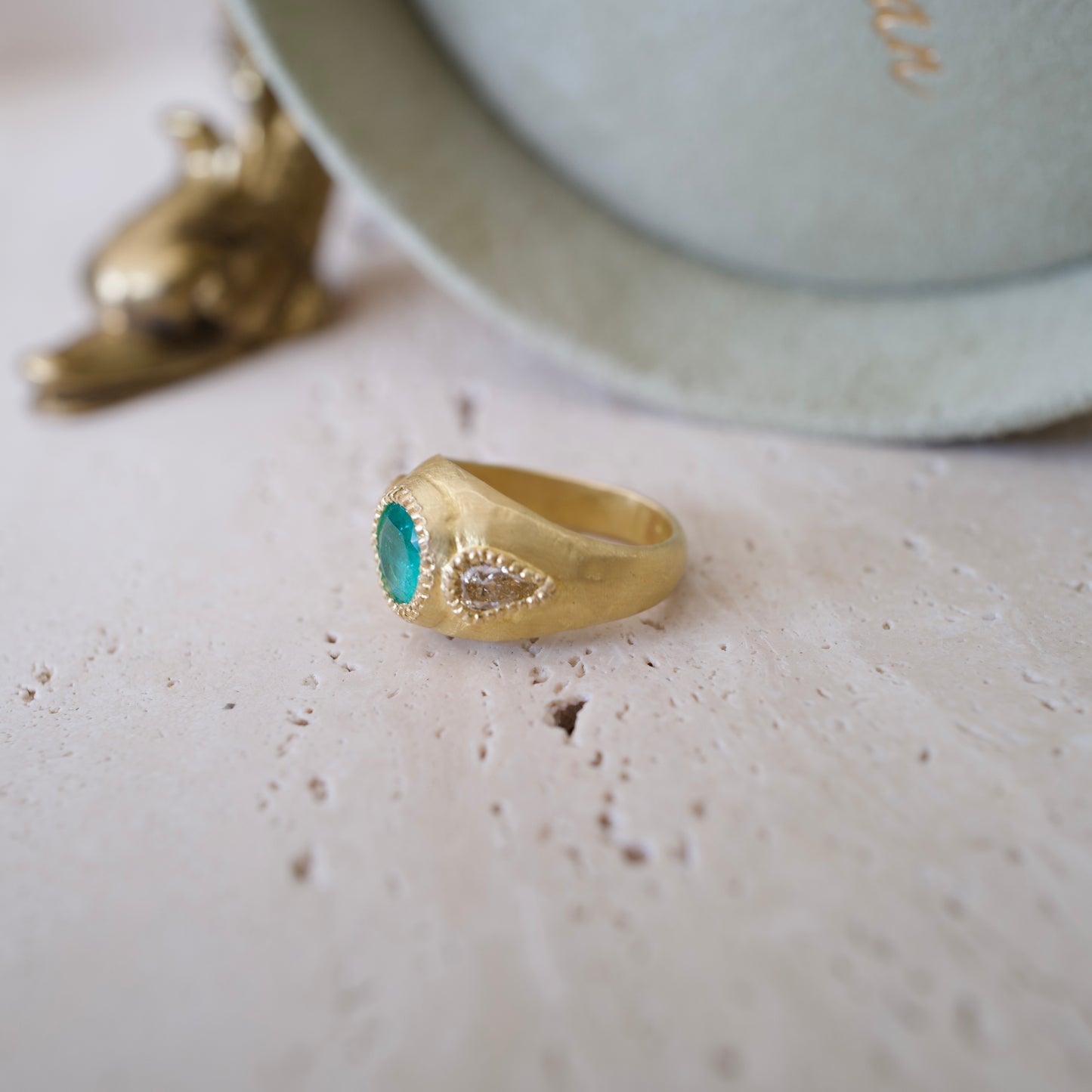 Emerald and pear diamond ring