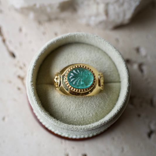 Carved emerald ring