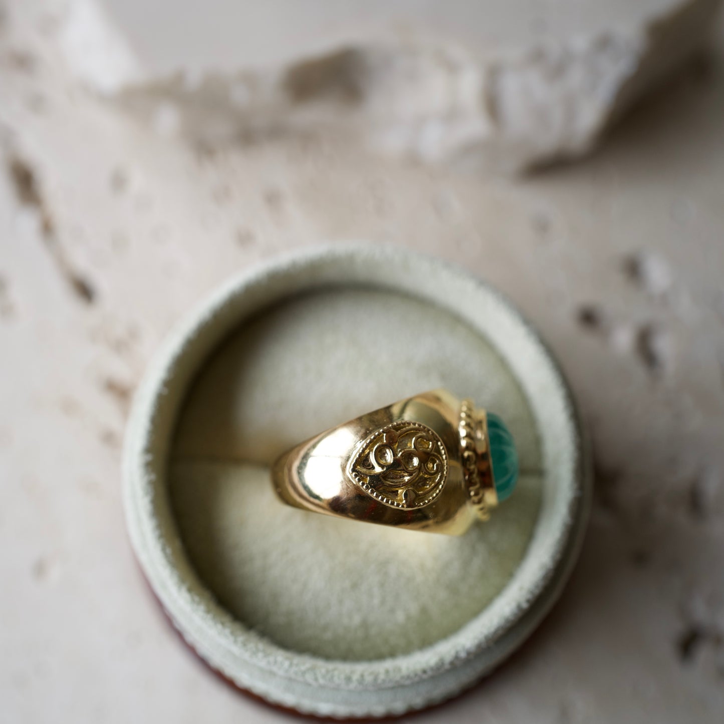 Carved emerald ring